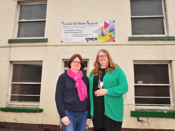Melanie Whiteside and Lucy Gratton from Ripon YMCA outside the house that is being refurbished.