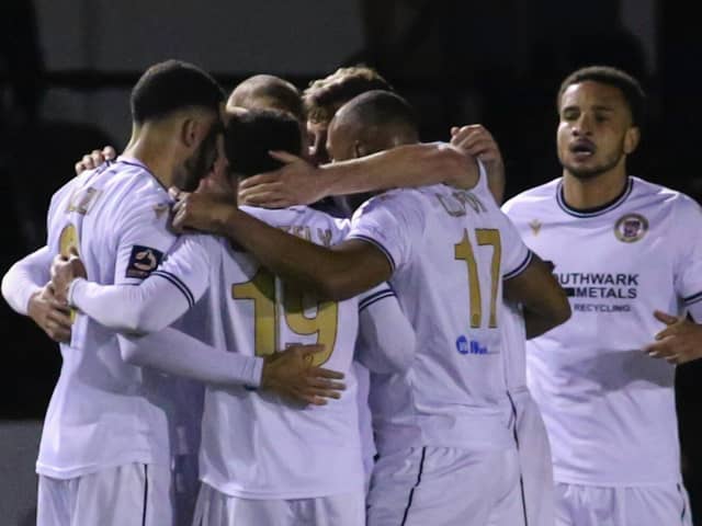 Bromley's players celebrate their late equaliser against Harrogate Town at the CNG Stadium. Picture: Matt Kirkham