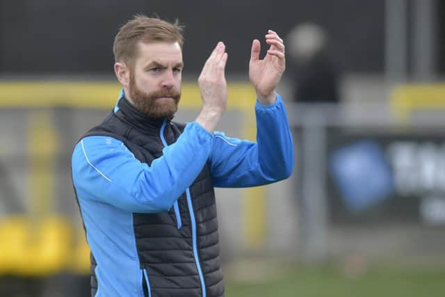 Harrogate Town manager Simon Weaver has confirmed that two players and two members of the coaching staff are self-isolating after suffering from coronavirus-type symptoms.