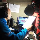 Presenter Ray Milligan in his airing cupboard studio.