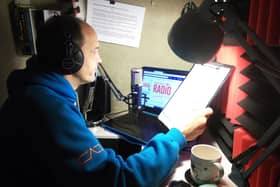 Presenter Ray Milligan in his airing cupboard studio.