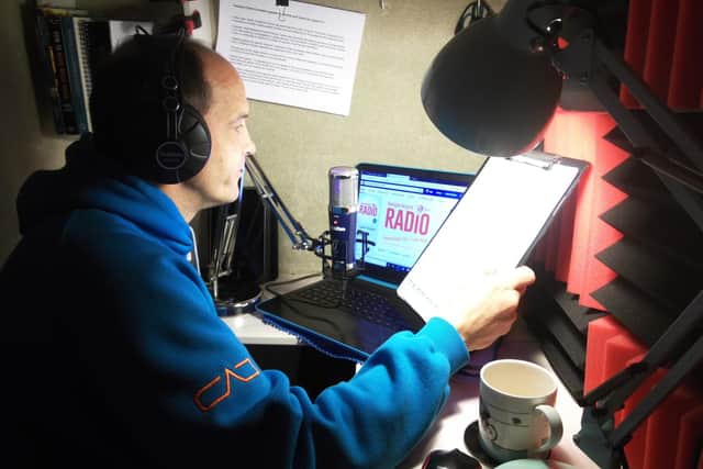 Presenter Ray Milligan in his airing cupboard studio.