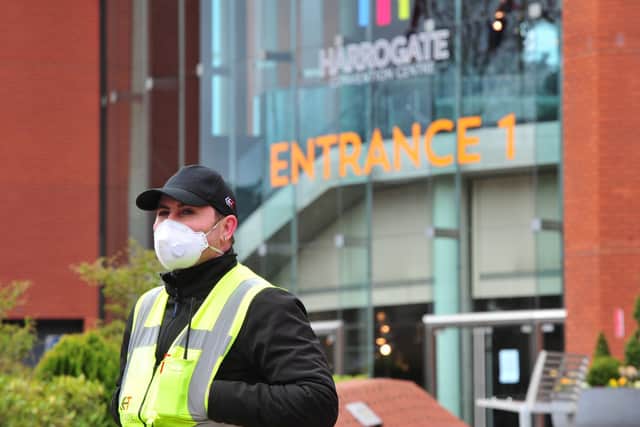 The centre has already been a visible hive of activity this week, with the arrival of security guards wearing protective masks, army officials and scores of construction workers. Picture: Gerard Binks.