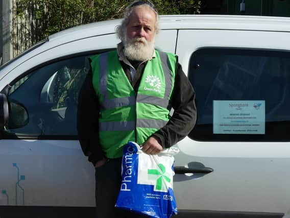 Harrogate District Green Party's ArnoldWarneken in front of his fully electric van, ready for deliveries.