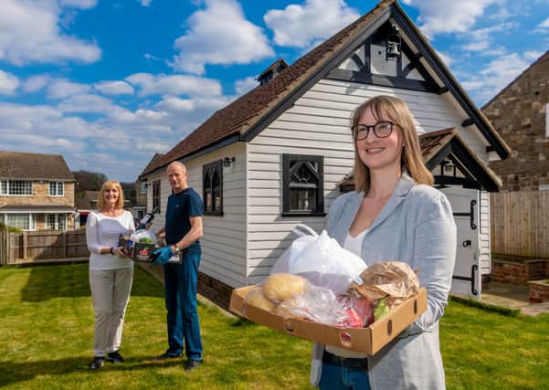 Pictured, from left, Covid-19 Community Support Volunteers Kathy and Dave Bird, with Emliy Tudball, Chair of the Stutton Social Committe, holding items ordered by residents who have joined the service. Picture: James Hardisty.