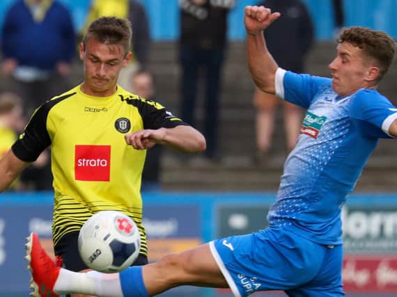 Barrow (blue kit) and Harrogate Town made up the top-two when the 2019/20 National League season was suspended in mid-March. Picture: Matt Kirkham