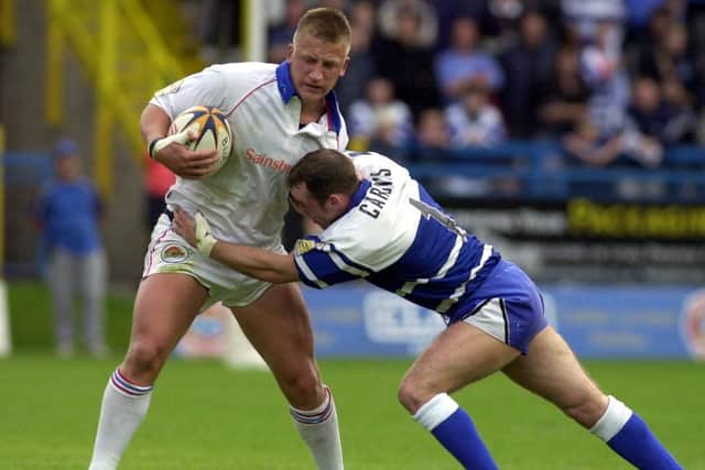 Wakefield Trinity's Keith Mason breaks through the Halifax tackle of Daryl Cardiss in 2001. (Matthew Lewis/SWPIX)