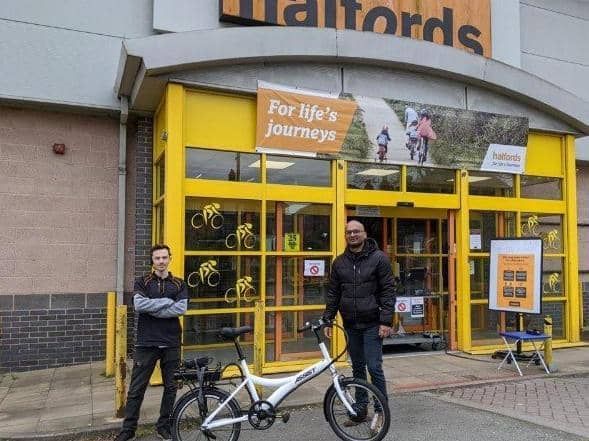 Harrogate Hospital doctor Naresh Gnanasekaran, right, with Daniel Locke of Halfords  who handed it over the new bicycle to him at the Harrogate branch.