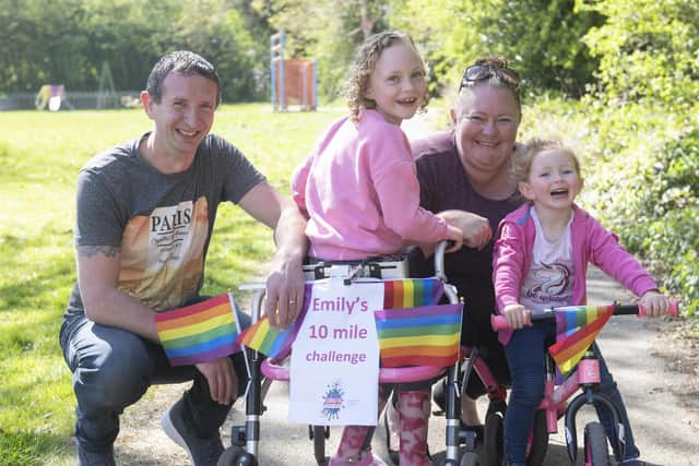 Emily with her family as she sets out on a walk as part of her daily permitted exercise during lockdown.