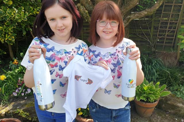 An inspiration to us all: Phoebe and Hermione Smith have designed a brightly-colouredrange of 'Happygate' merchandise with the aim of celebrating all the good things that have emerged in our community during this crisis.