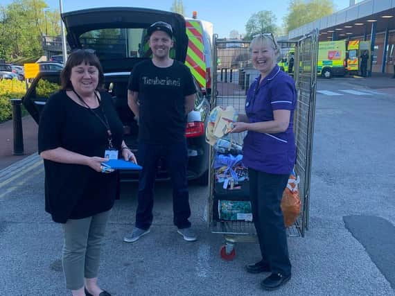 Harrogate Scrubbers' donations arriving at Harrogate District Hospital - Gareth Grant from Supplies for Key Workers delivers scrubs.