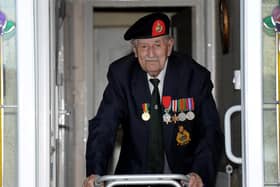 Harrogate's 95 year-old D-Day veteran John Rushton at the front door of his house ready for VE Day. (Picture Gerard Binks)