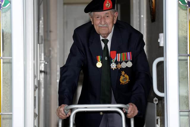 Harrogate's 95 year-old D-Day veteran John Rushton at the front door of his house ready for VE Day. (Picture Gerard Binks)