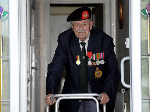 Harrogate's 95 year-old D-Day veteran John Rushton at the front door of his house ready for VE Day. (Picture Gerard Binks)