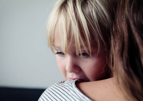 sad crying little girl hugging mother, parenting concept