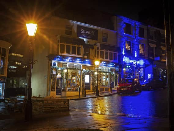The vibrant blue night-time lights of Harrogates famous Blues Bar where all live music has stopped since lockdown.