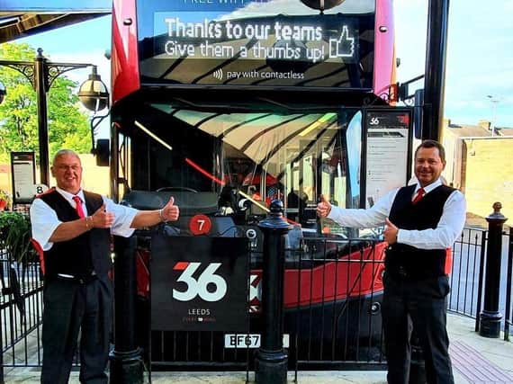 Peter Bowman (left) and Martin Sykes from The Harrogate Bus Company give a thumbs-up signal as bus services increase from Sunday,  May 31.