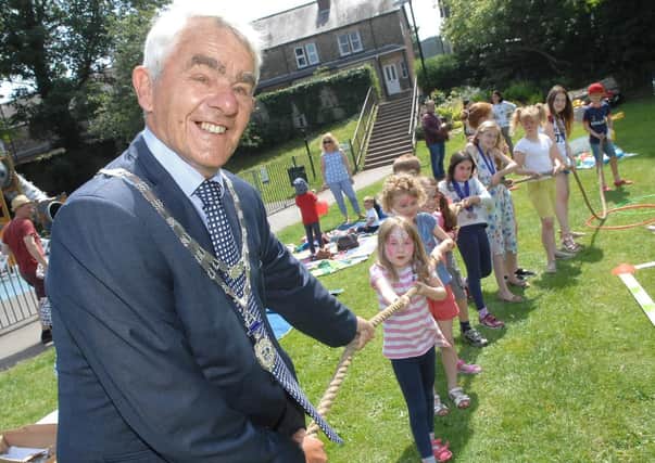 NAWN 1806101AM1 Sandringham Park Funday. The Mayor of Wetherby Coun Galan Moss has his work cut out in the tug o war (1806101AM1)