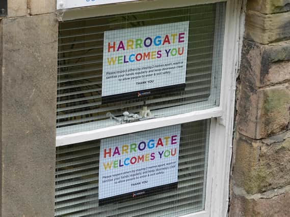 One of the windows in Harrogate with the free Harrogate Welcomes You poster courtesy of Harrogate BID.