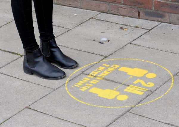 Distance markers outside shops. Picture Richard Ponter.