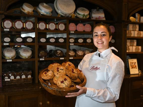 Eve Pike, assistant retail manager at Bettys in the Harrogate shop which is reopening on Monday, with a basket of fat rascals. Picture: Gary Longbottom.