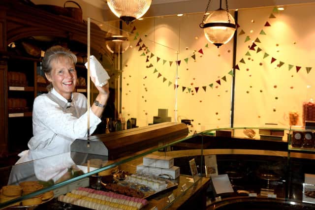 Karen Merrin retail assistant at Bettys in the Harrogate shop which is reopening on Monday, getting the plastic screens ready. Picture: Gary Longbottom