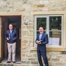 Rev Mike Poole blesses the homes at Skaife Row, Pateley Bridge