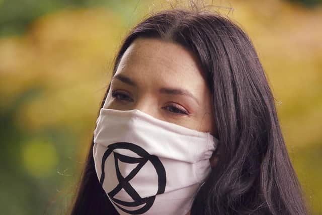 A member of Extinction Rebellion Harrogate wearing a face mask against Covid-19 during the Prince of Wales roundabout. (Picture Edward Lee)
