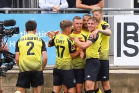 Harrogate Town players celebrate Jack Muldoon's winner against Boreham Wood. Picture: Matt Kirkham