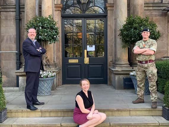 Accolade for the HRH Group of hotels in Harrogate - Simon Cotton, Fran Patrick and an MOD representative outside the White Hart Hotel in Harrogate.