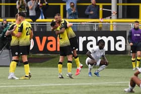 Harrogate Town players celebrate at the final-whistle after beating Boreham Wood 1-0 to seal their place in the National League play-off final. Picture: Getty Images