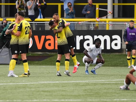 Harrogate Town players celebrate at the final-whistle after beating Boreham Wood 1-0 to seal their place in the National League play-off final. Picture: Getty Images