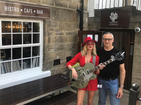 Supporting live music - Singer-song writer Hayley Gaftarnick with Harrogate's Fashion House Bistro owner David Dresser.