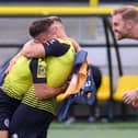 Josh Falkingham, George Thomson and Simon Weaver celebrate after Harrogate Town sealed their place at Wembley. Picture: Matt Kirkham