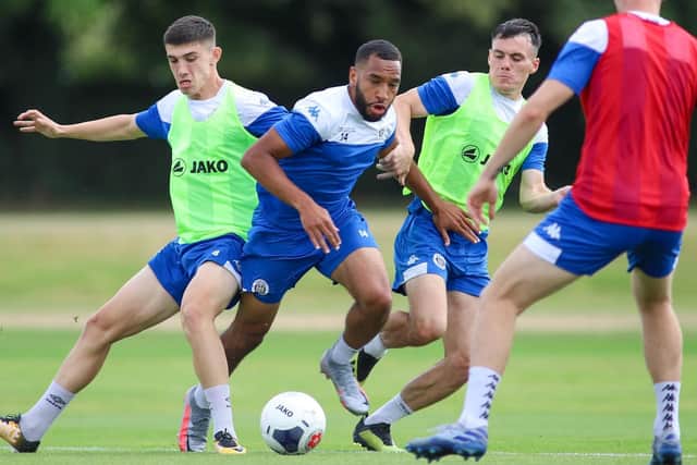 Town winger Brendan Kiernan bursts between Kian Harratt and Ryan Fallowfield during a training session the day before the club's first-ever Wembley appearance.