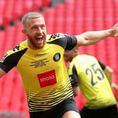 George Thomson celebrates after putting Harrogate Town 1-0 up against Notts County in the play-off final at Wembley. Pictures: Getty Images