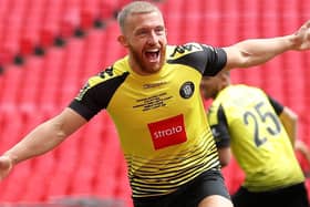 George Thomson celebrates after putting Harrogate Town 1-0 up against Notts County in the play-off final at Wembley. Pictures: Getty Images