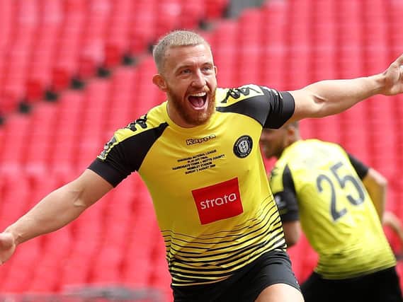 George Thomson celebrates after putting Harrogate Town 1-0 up against Notts County in the play-off final at Wembley. Pictures: Getty Images