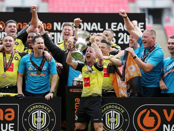 Going up!!! Harrogate Town players celebrate their promotion to the Football League after Sunday's 3-1 win over Notts County. Pictures: Getty