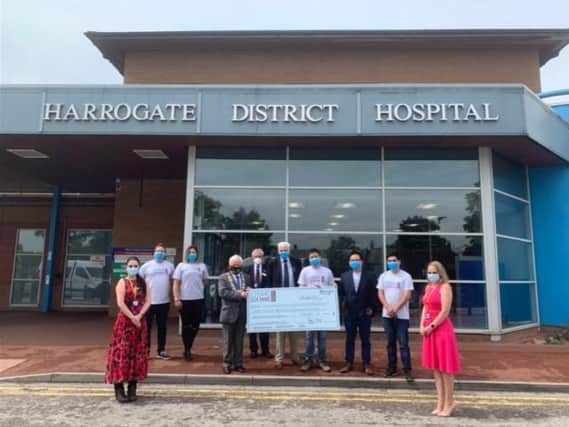 Face masks hand over - John Zhou and Tony Chen with representatives of Harrogate District NHS Foundation Trust, North Yorkshire County Council, Harrogate Borough Council and Ripon Rowels Rotary Club.