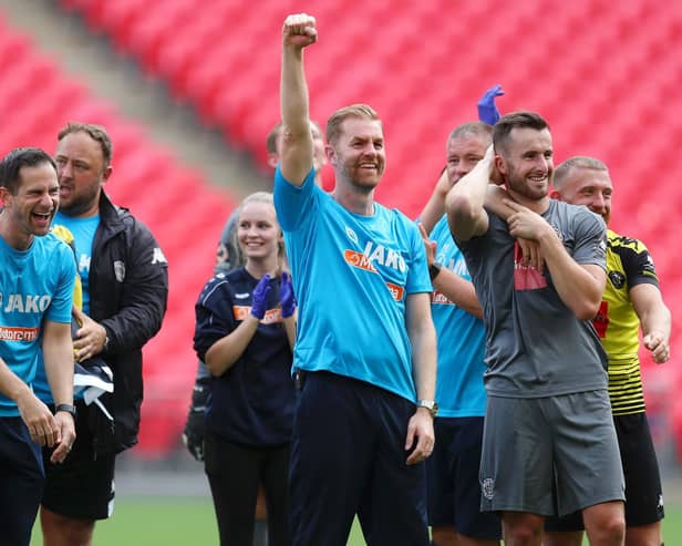 Harrogate Town's manager Simon Weaver celebrates after his team's victory in the Vanarama National League play off final at Wembley Stadium.