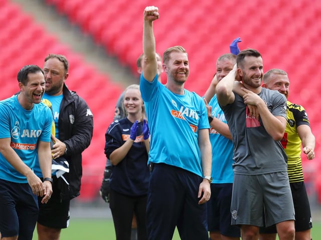 Harrogate Town's manager Simon Weaver celebrates after his team's victory in the Vanarama National League play off final at Wembley Stadium.