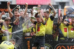 Harrogate Town players celebrate winning the National League Promotion Final at Wembley on Sunday. The 3-1 win secured Town's place in the Football League for the first time in their history. Picture: Getty Images