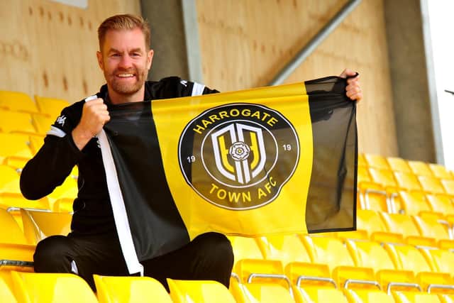 Harrogate Town manager Simon Weaver sits in the new Family Stand which will hold 880 supporters and take the ground capacity above the 5,000 requirement. Picture: Gerard Binks