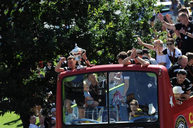 An open-top bus toured the streets this morning in celebration of Harrogate Town's promotion.