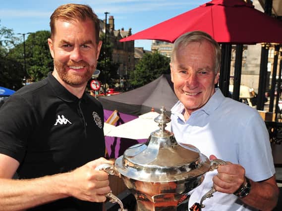 Simon and Irving Weaver with the National League play-off final winners' trophy. Pictures: Gerard Binks