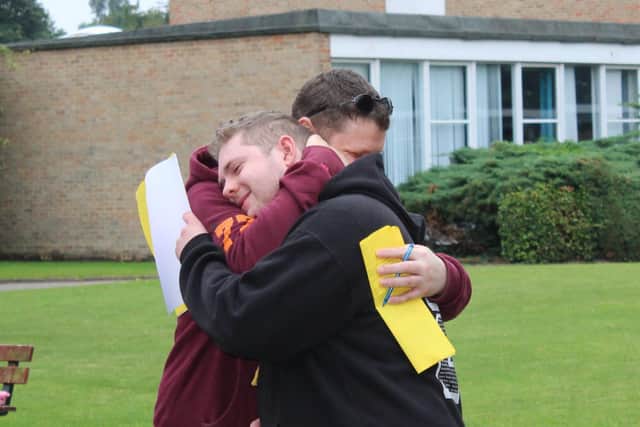 A father and son celebrating A Level results day at Tadcaster Grammar School.