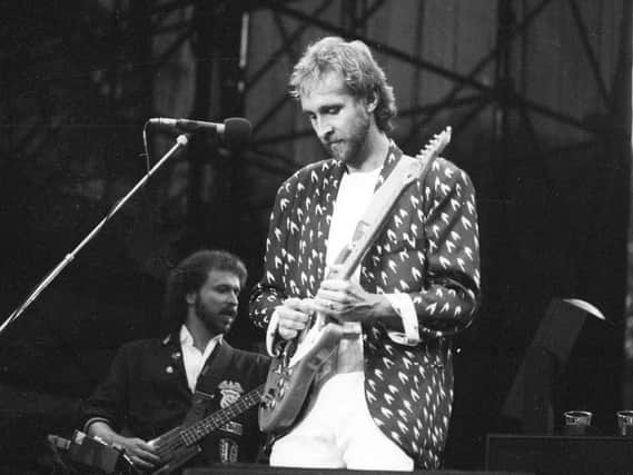 Mike Rutherford of Genesis on stage during the band's Roundhay Park concert in Leeds in 1987.