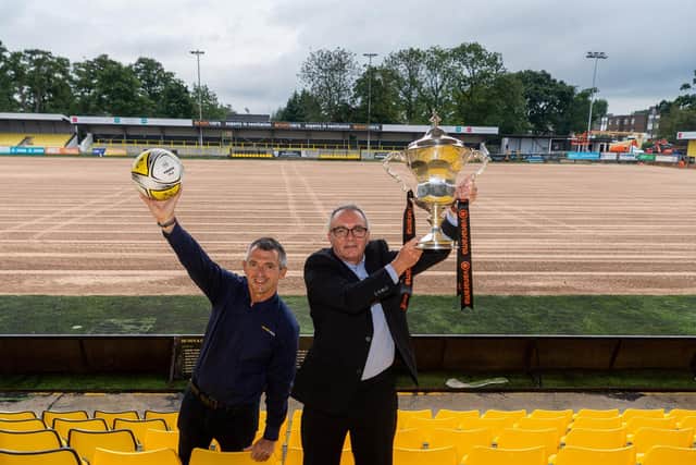 Exciting new deal- Andy Makin, sponsors EnviroVent's managing director celebrates the announcement at Wetherby Road with Garry Plant, managing director of Harrogate Town - and the league trophy!