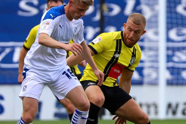 George Thomson in action during Harrogate Town's Carabao Cup clash with Tranmere Rovers.
